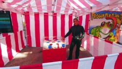 This is a picture of our goblet ball carnival game with one of our professionally trained game attendants at a corporate event in south florida