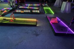 LED Mini golf course complete with obstacles at a private event.